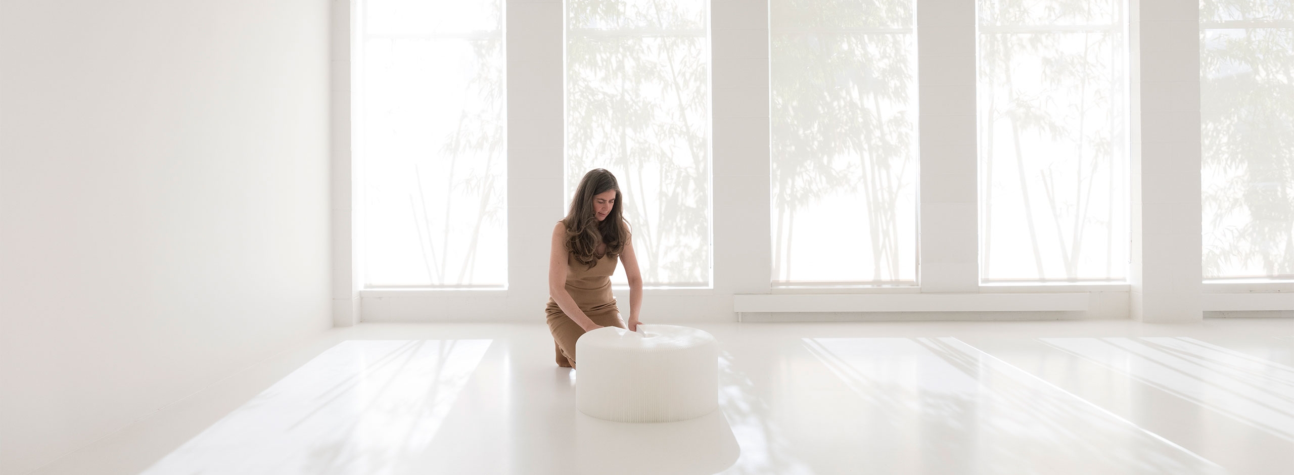 The softseating folding paper stool by molo is available two materials and several colors. This white stool is a paper-like, water resistant textile. Original design from the collection of paper furniture designed by Stephanie Forsythe and Todd MacAllen.