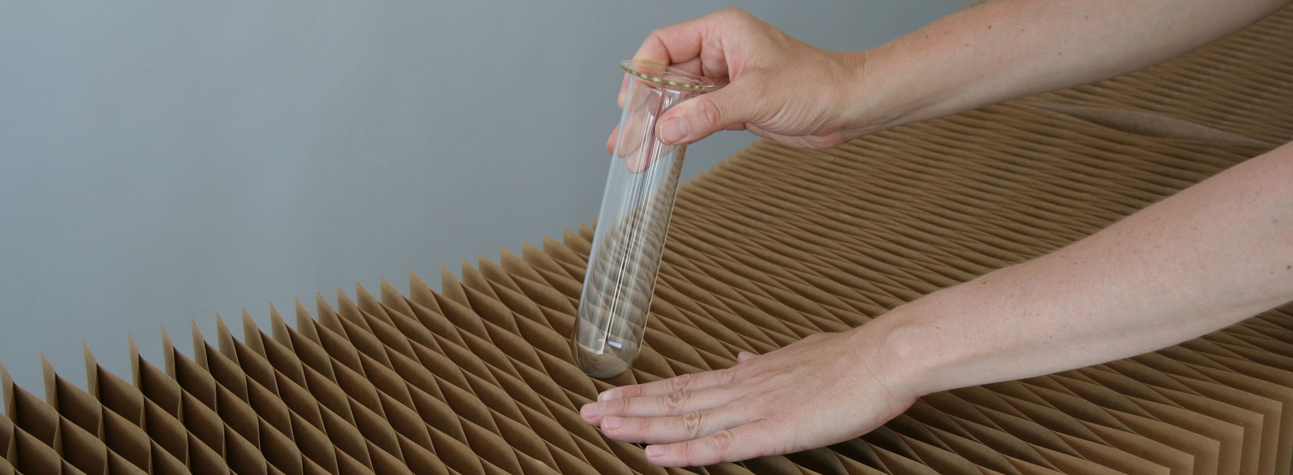empty glass vase inserted into brown kraft softblocks