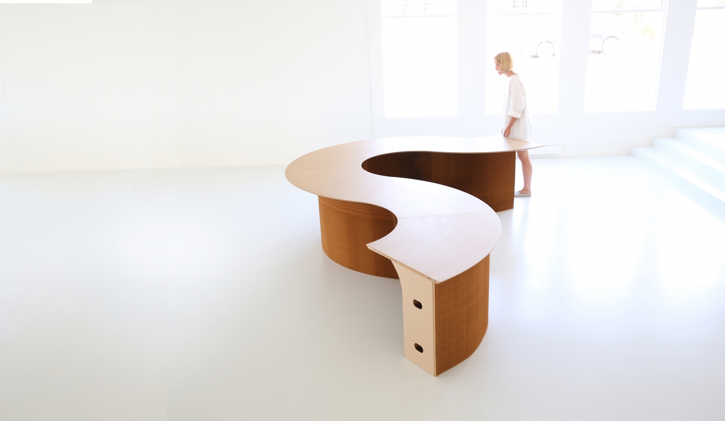 wedge top cantilever table forming a serpentine table