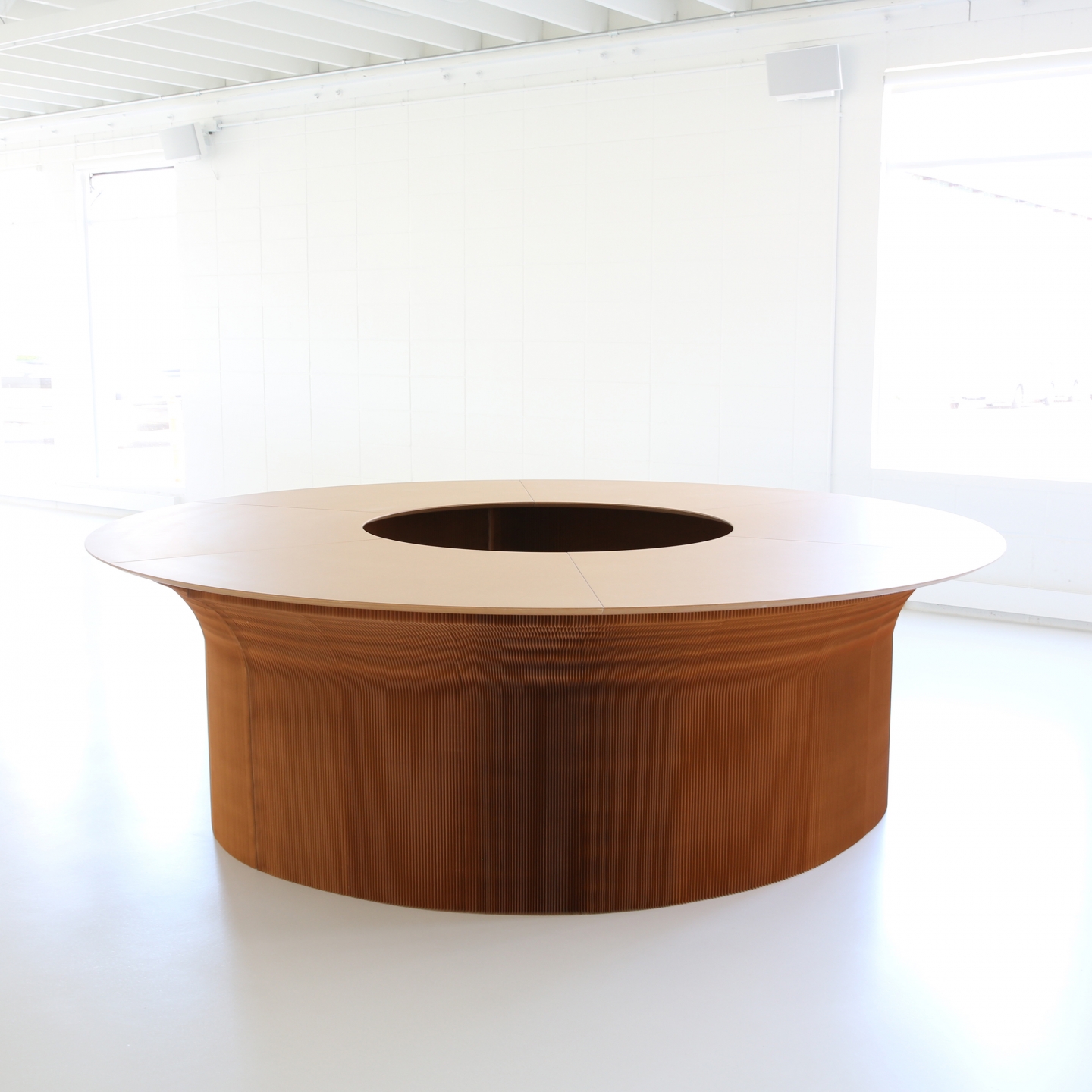 wedge top cantilever table forming a large, round table