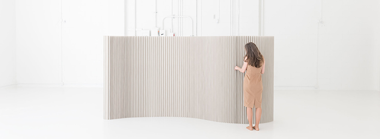 textile softwall acoustic wall made in custom color Pantone Warm Gray 4. This folding paper wall is made by molo.