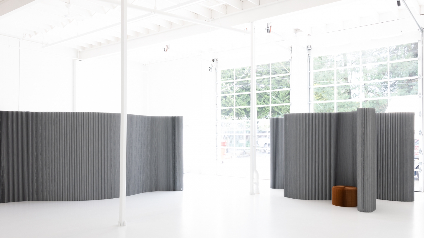 custom colour textile softwalls rearrange space in an open floor plan.