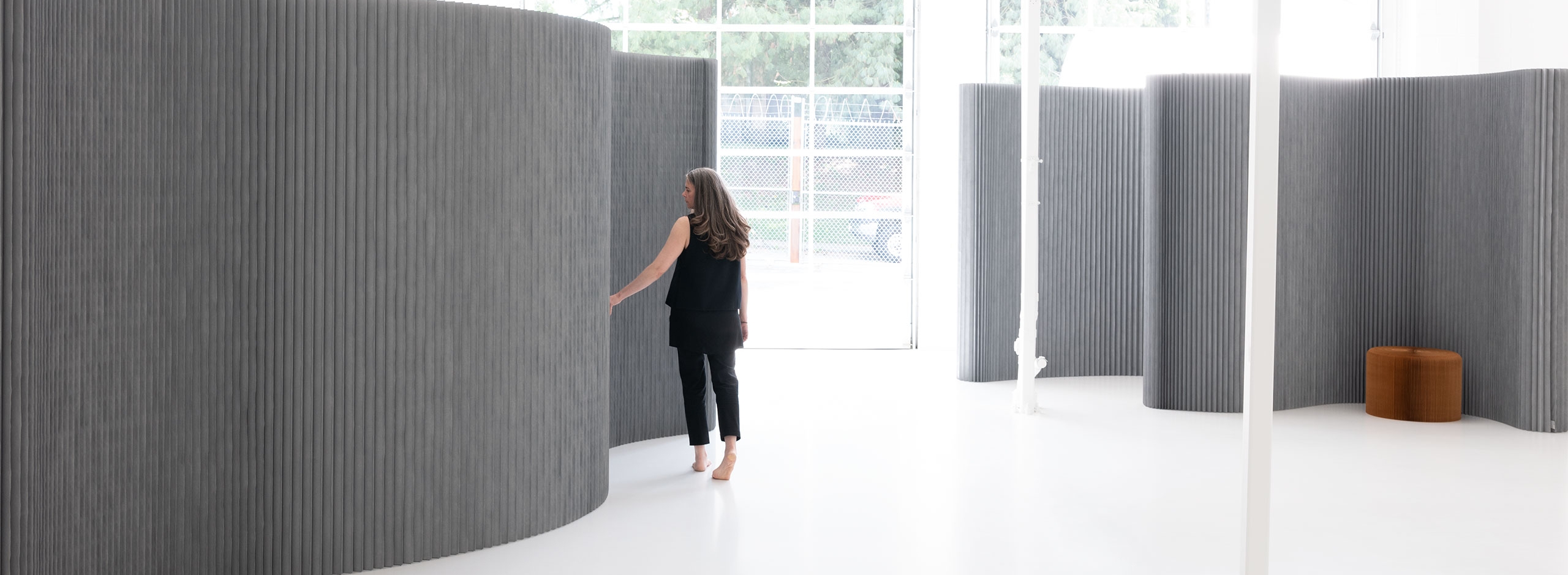 This folding wall can be arranged into any shape as an acoustic room divider, event backdrop or room divider.