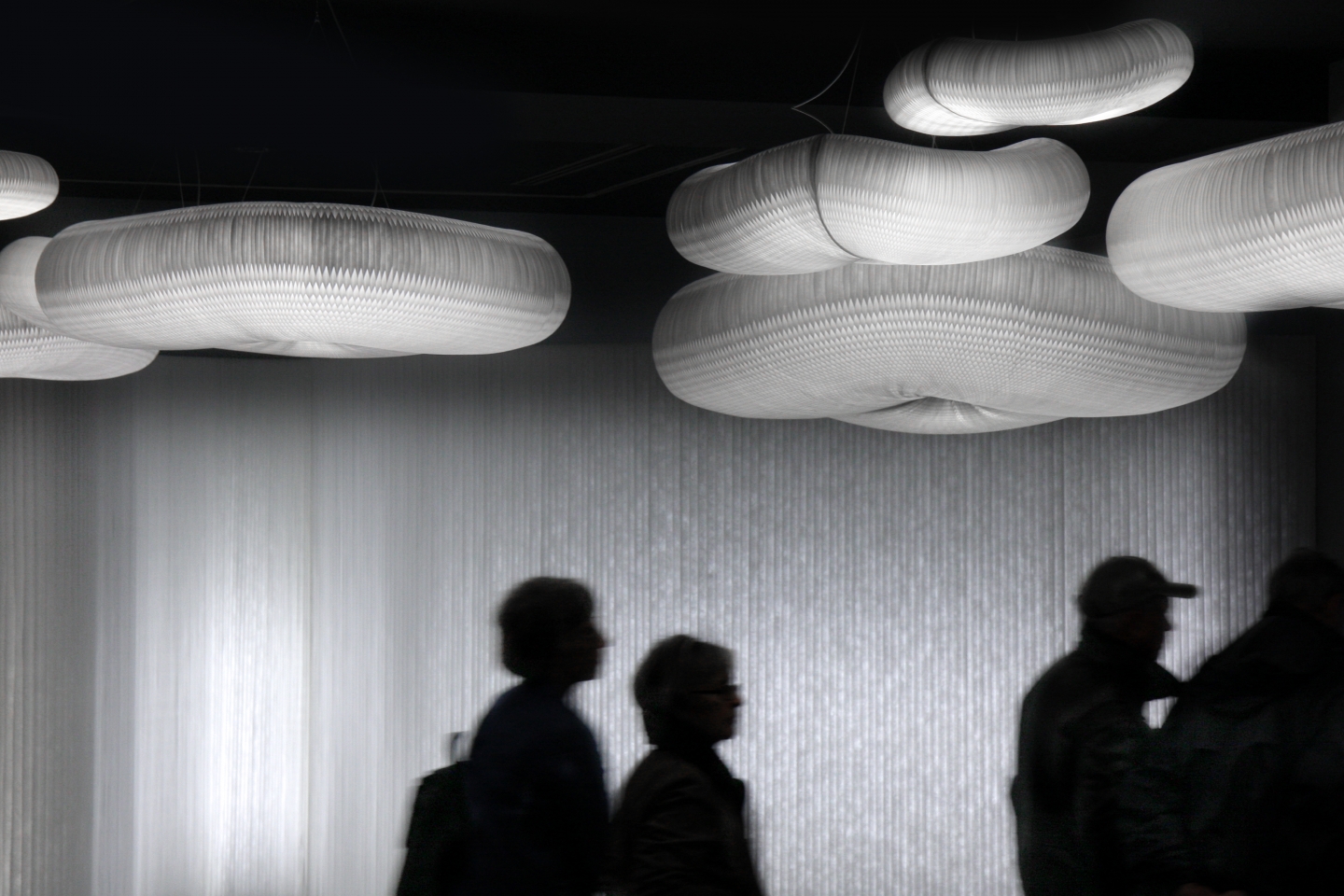 an installation featuring cloud pendants and textile softwall with LED at the Vancouver Art Gallery