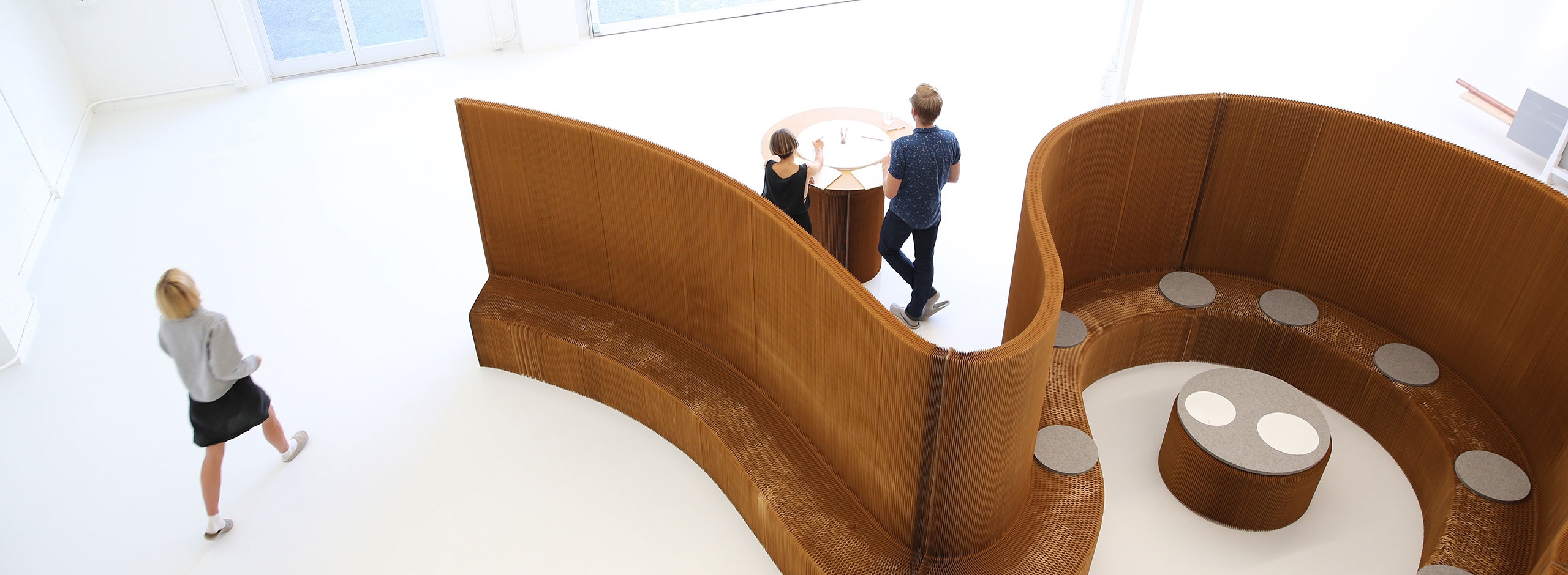 a meeting room made from benchwall, softseating and cantilever table