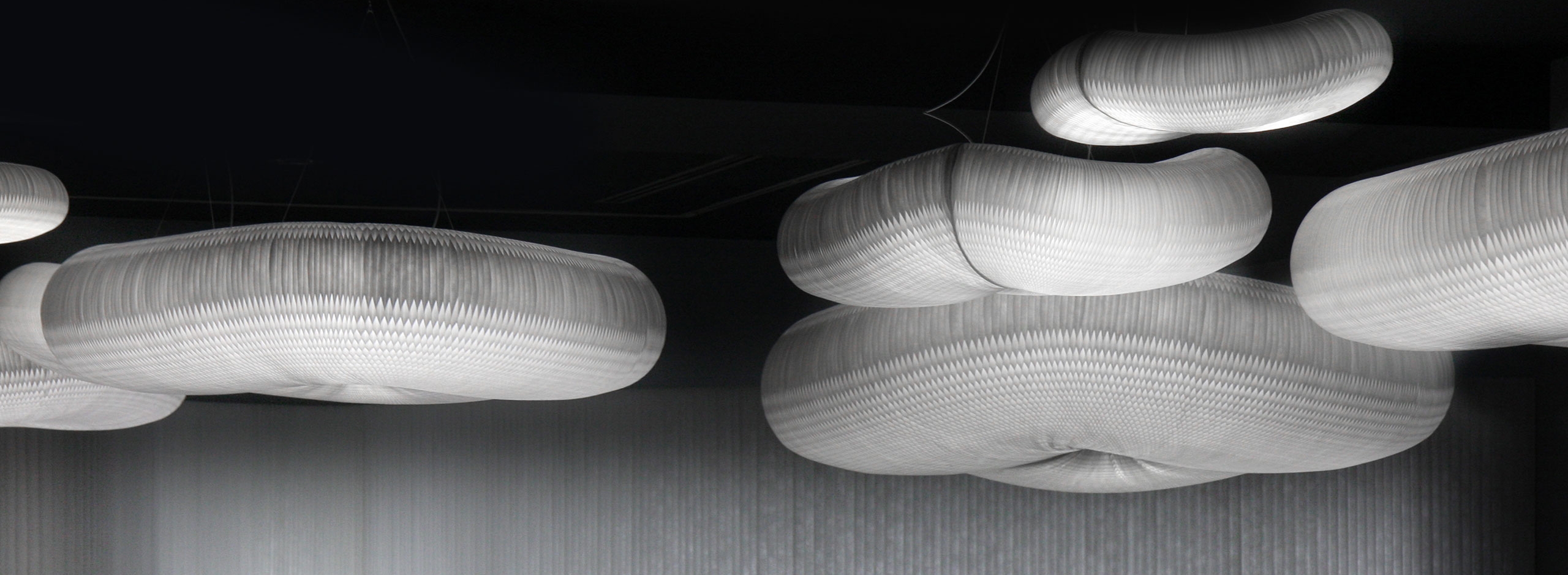 illuminated cloud pendants and textile softwall with LED