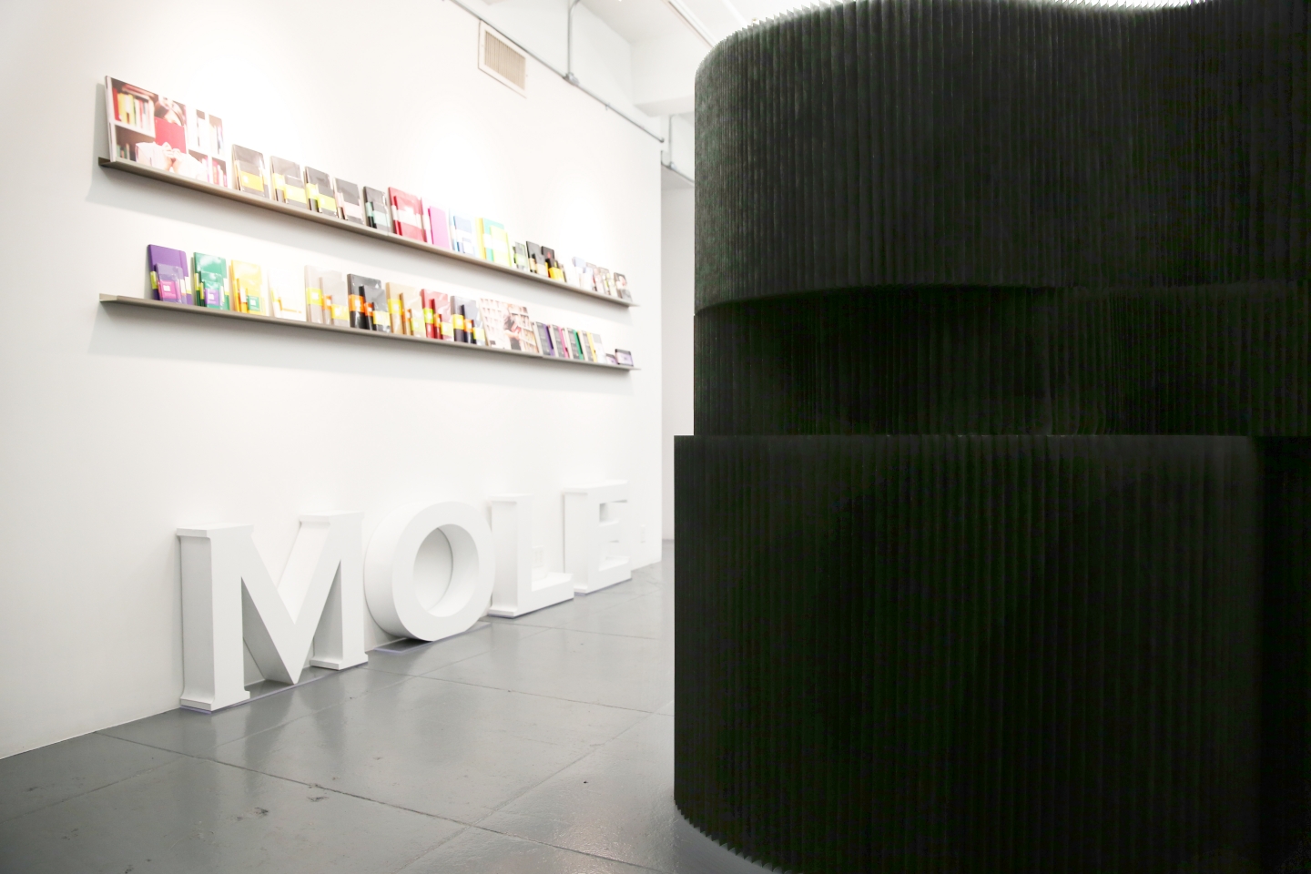 molo black textile softblocks and paper softseating at Moleskine offices in New York