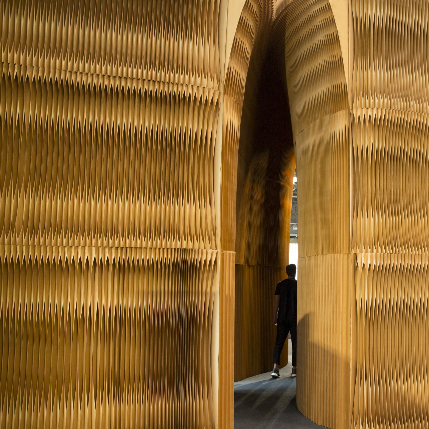 inspired by sea caves, a monolithic fissure made from softwalls wound through the ICFF installation - mobile folding partition walls