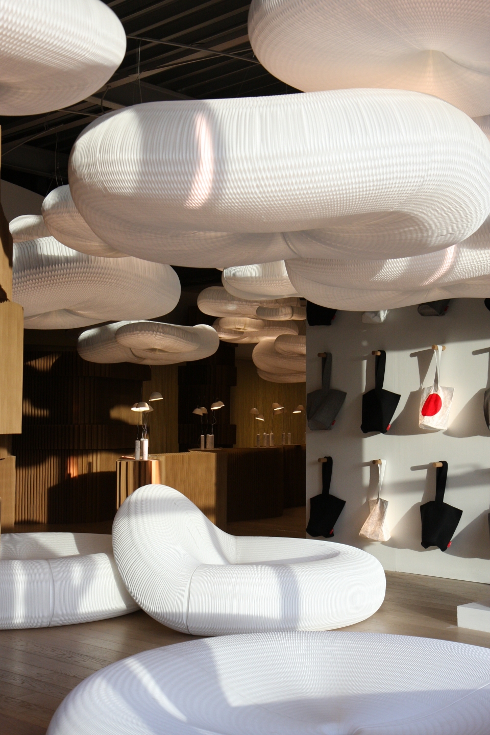 textile loungers create striking mirrors to the clouds floating above.