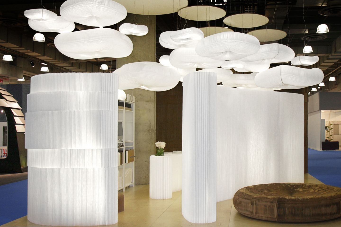 cloud pendant lighting, modular paper and textile partition walls and paper seating and furniture.