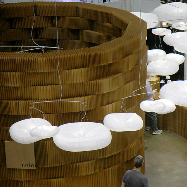 Paper + textile softblock / room divider walls / paper lighting - Overhead view of a tower made of paper softblocks at Dwell on Design.