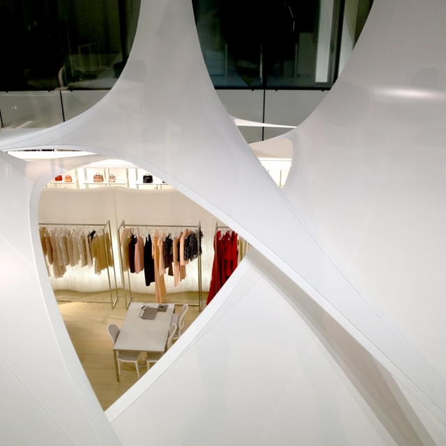white fabric acoustic office wall dividers by molo - dior headquarters in paris
