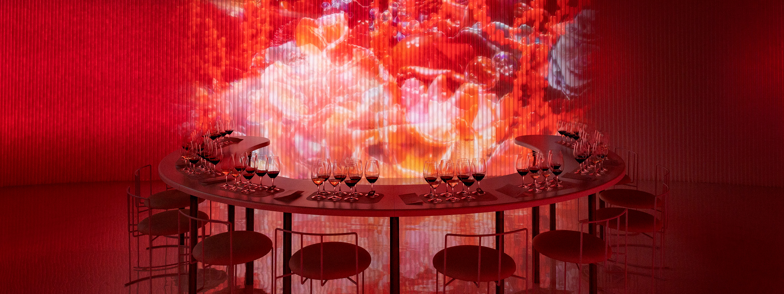 white textile softwall with coloured light projections, illuminated red wall, slide, molo